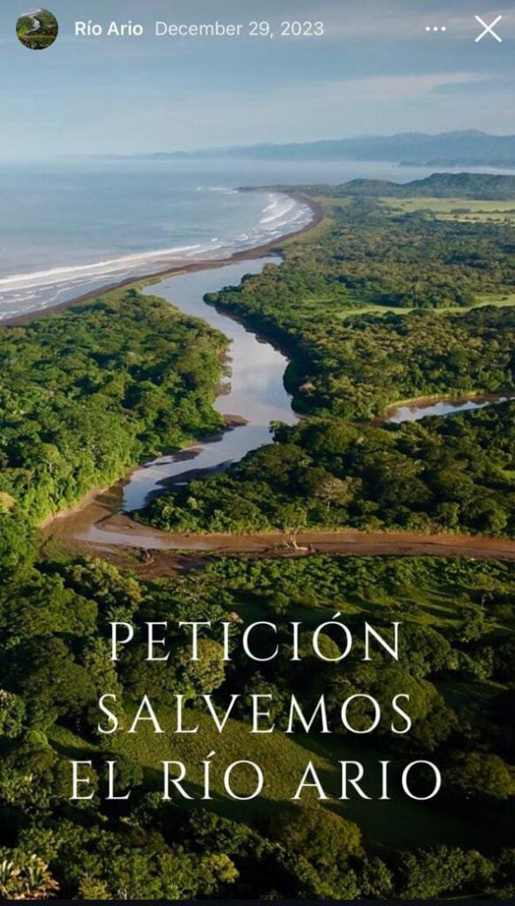 Aerial view of Río Arío winding through the Costa Rican jungle, showing natural beauty and visible excavation impacts near Santa Teresa.