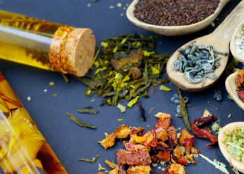 Display of traditional Chinese medicine herbs and essential oils used for natural healing and balance