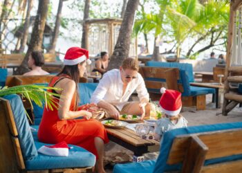 Family enjoying the holiday season at Banana Beach in Santa Teresa, Costa Rica