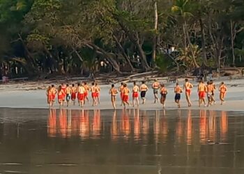 Santa Teresa lifeguards participating in a beach training exercise in Costa Rica