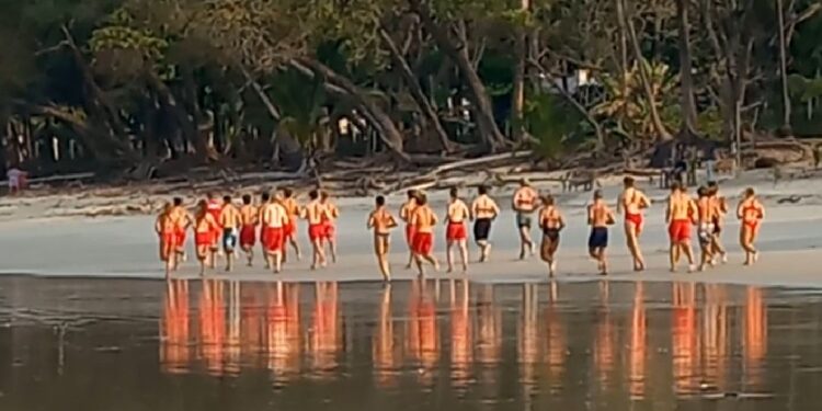 Santa Teresa lifeguards participating in a beach training exercise in Costa Rica