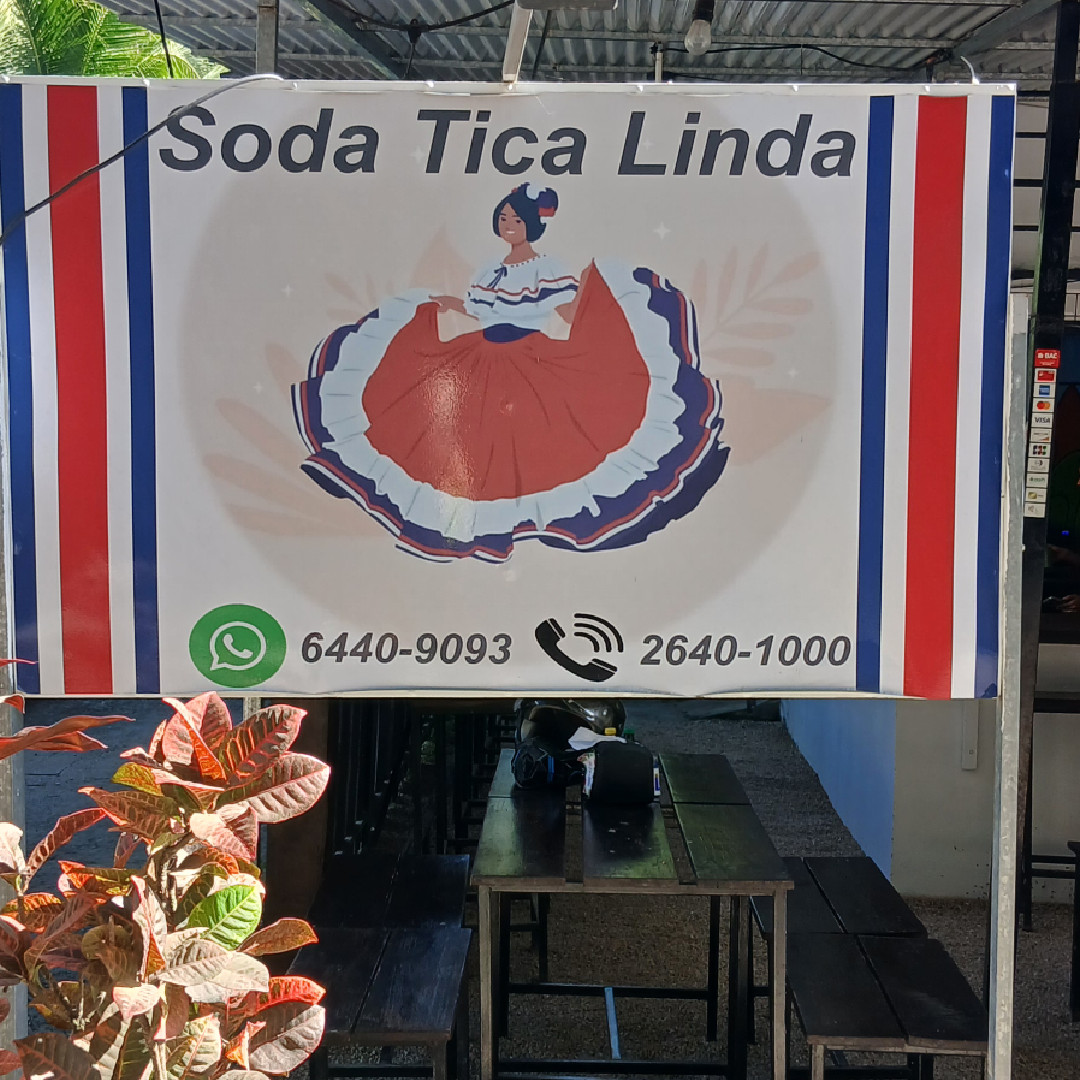 Sign for Soda Tica Linda with a traditional Costa Rican dish image.