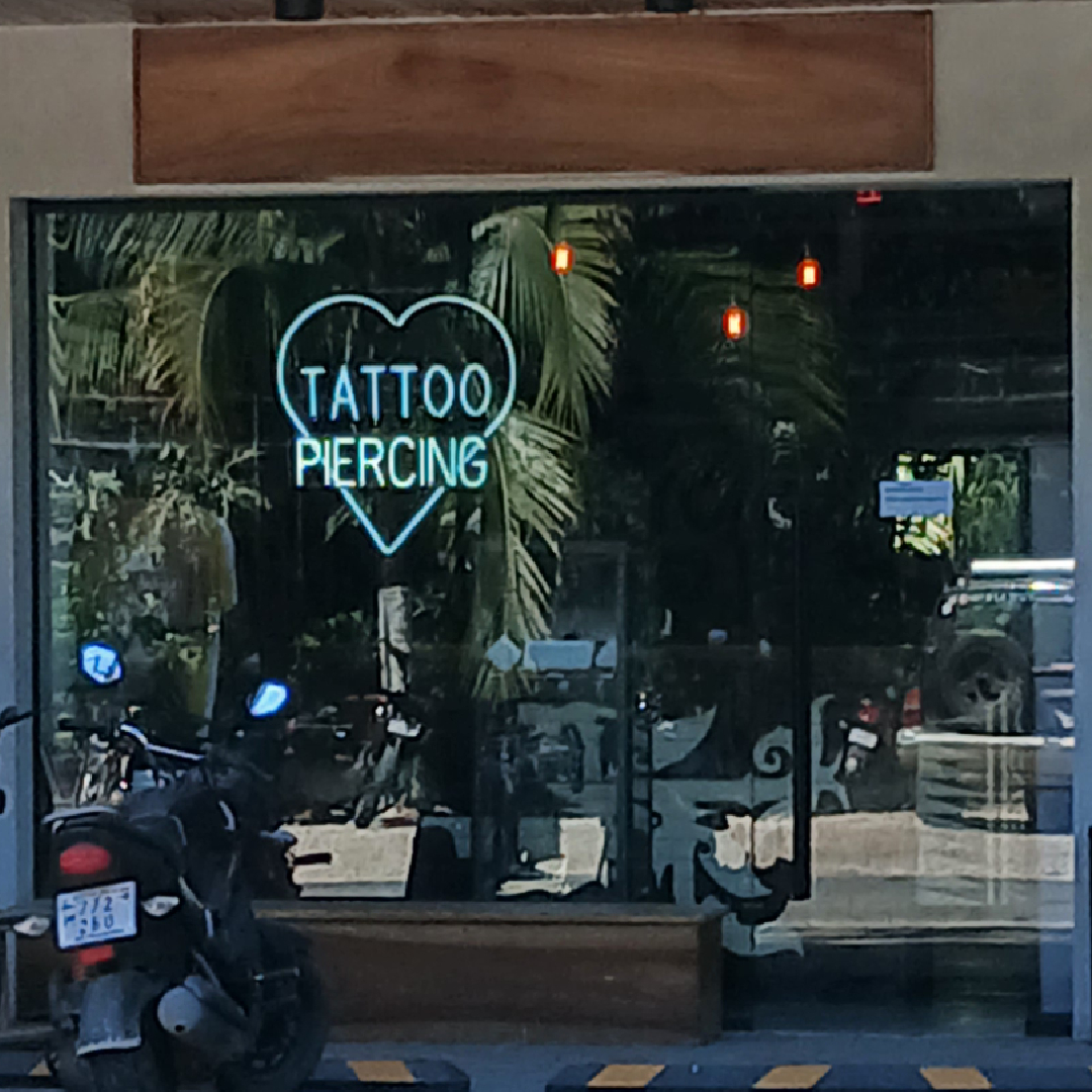 Goodlife Tattoo and Piercing neon sign and storefront