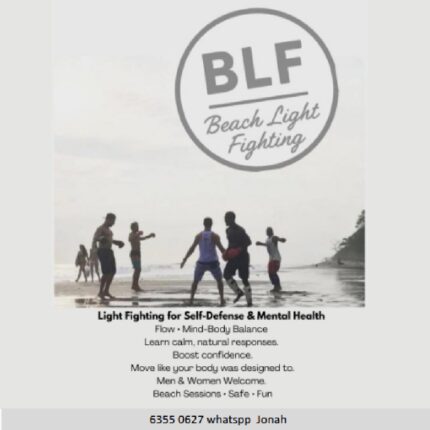 People practicing light fighting on beach.