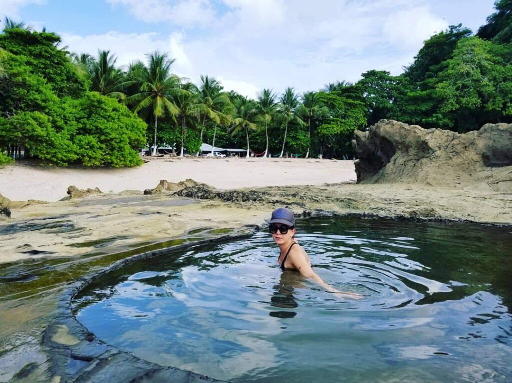Natural tidal pools in volcanic rock along northern Santa Teresa coastline