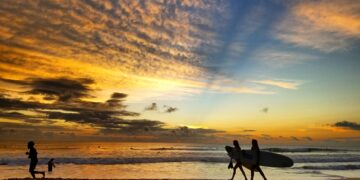 Women surfers walking at sunset on Santa Teresa beach Costa Rica travel safety guide