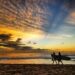 Women surfers walking at sunset on Santa Teresa beach Costa Rica travel safety guide