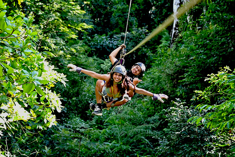 Ziplining through jungle canopy in Mal País Costa Rica