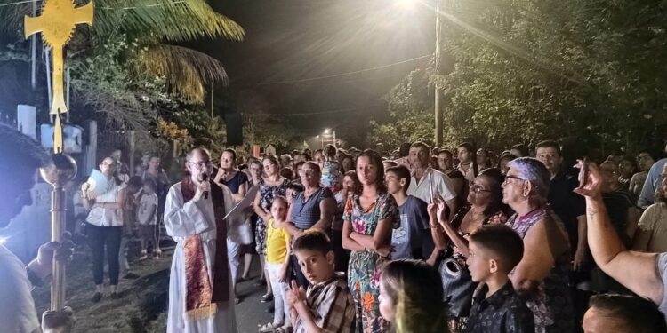 Good Friday Via Crucis procession at Iglesia Católica de Cóbano Costa Rica with community gathered in street service