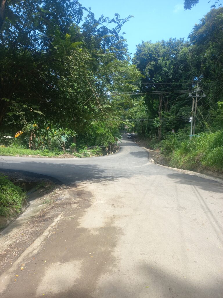 Construction crews building water drainage ditches along a newly improved road in Playa Hermosa, Puntarenas Province.