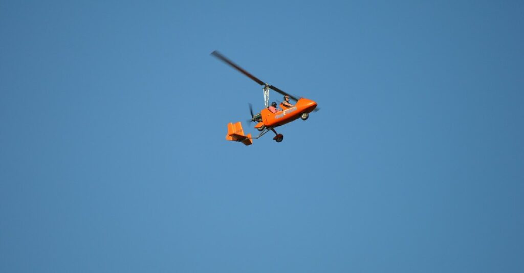 Gyrocopter flying over coastline in Santa Teresa Costa Rica