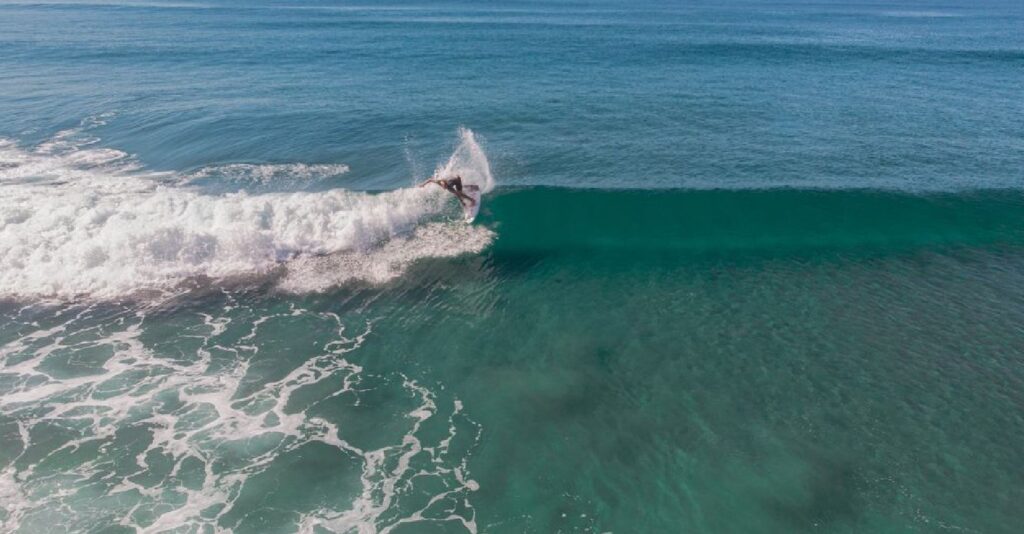 Surfer riding a wave in Santa Teresa Costa Rica