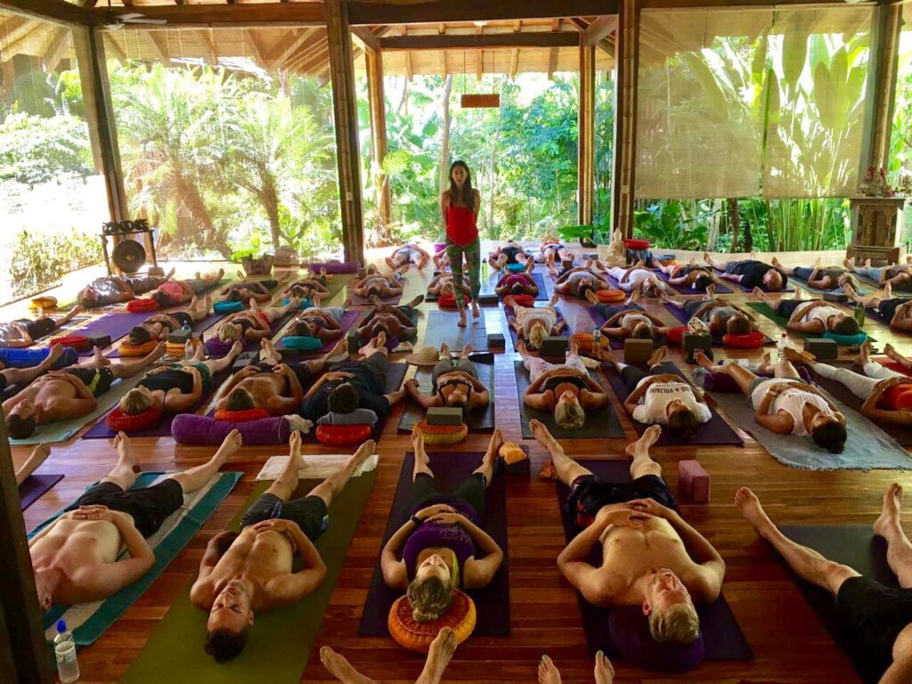Large yoga class at Pranamar with many students practicing together