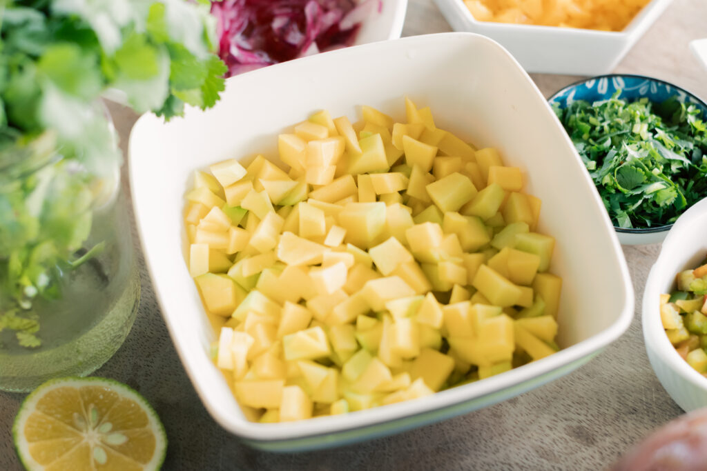 Diced green mango pieces for ceviche fresh tropical fruit preparation Costa Rica