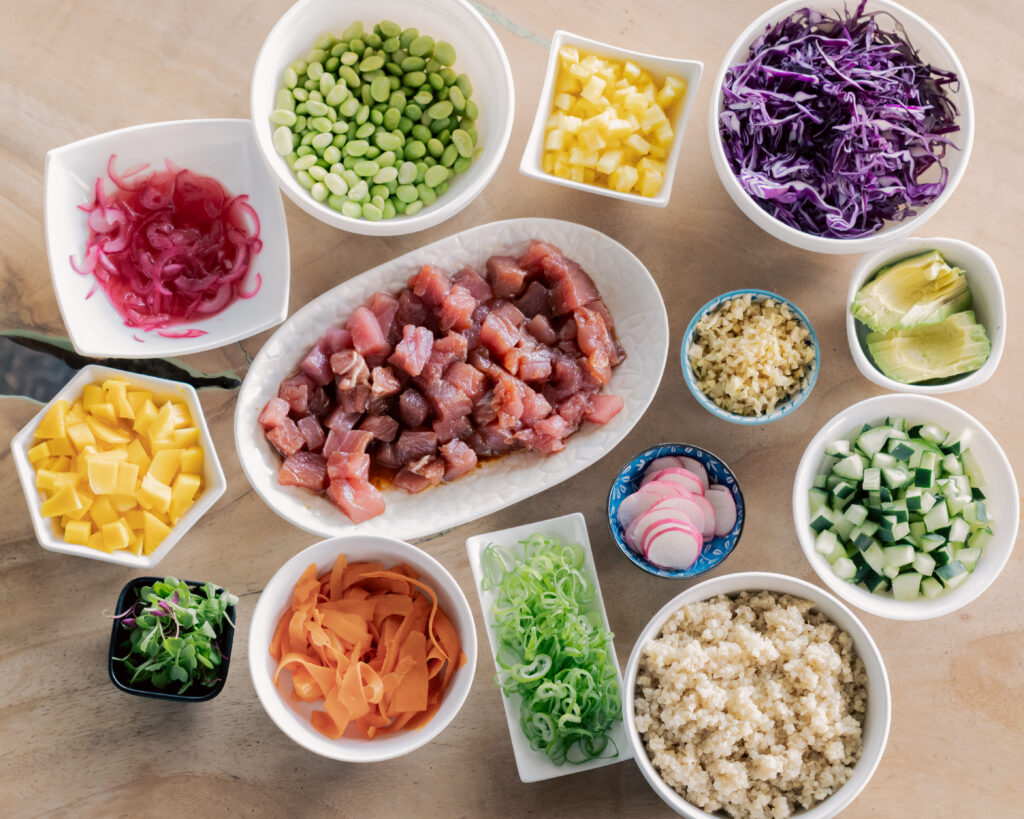 Fresh ingredients for tuna poke bowl including mango avocado tuna cucumber and sesame seeds Costa Rica