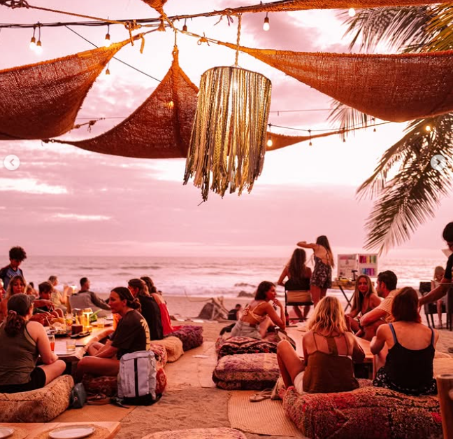 Sunset beachfront dining table at Uma restaurant in Santa Teresa Costa Rica with ocean view