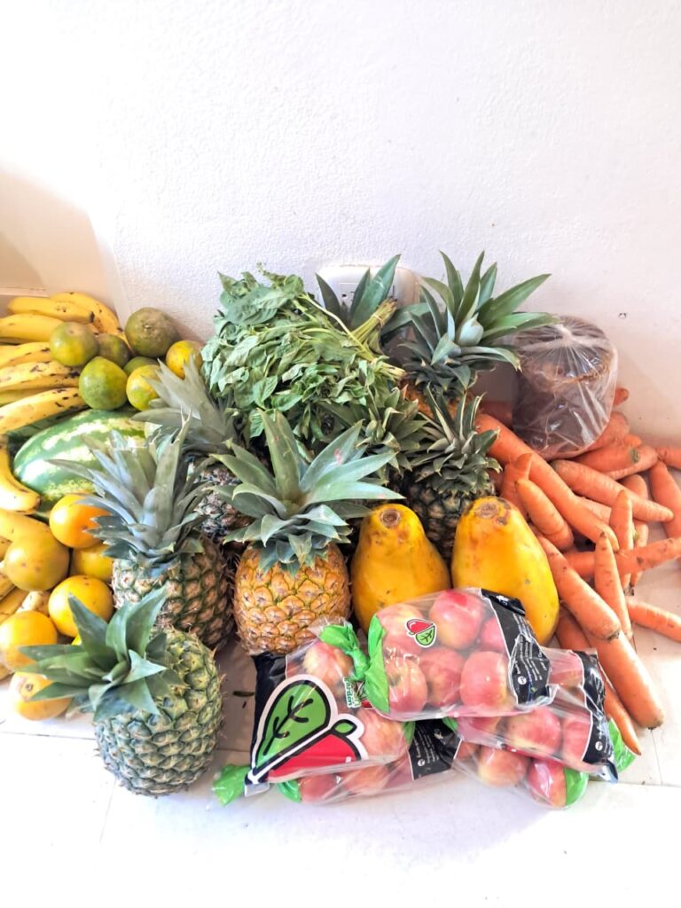 Selection of fresh tropical fruits including pineapple, bananas, mangoes and carrots used to make natural juices in Santa Teresa Costa Rica