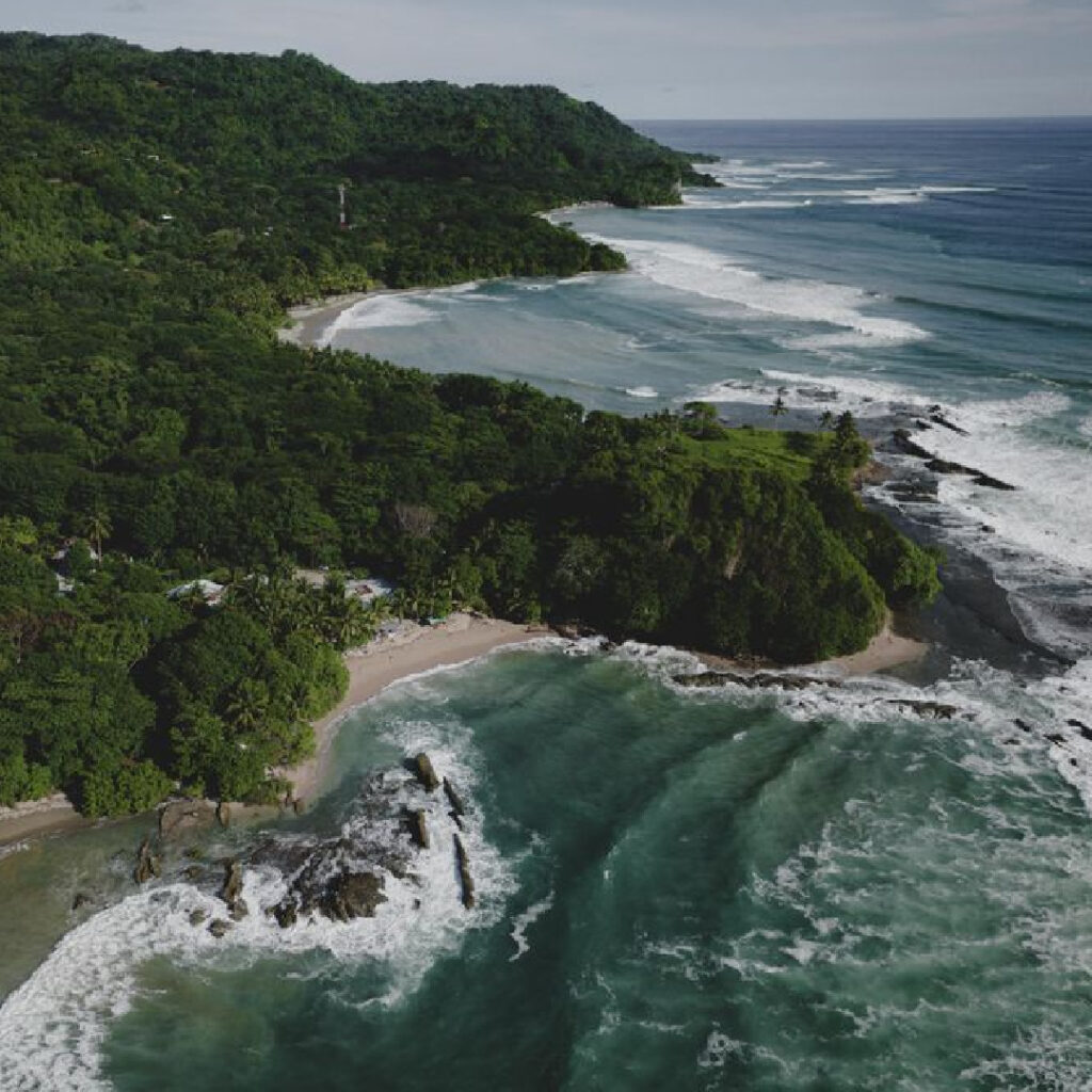 Rugged rocky coastline with jungle and crashing waves Malpais Costa Rica