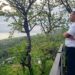 Chef Eitan overlooking jungle and ocean from mountain deck in Santa Teresa Costa Rica
