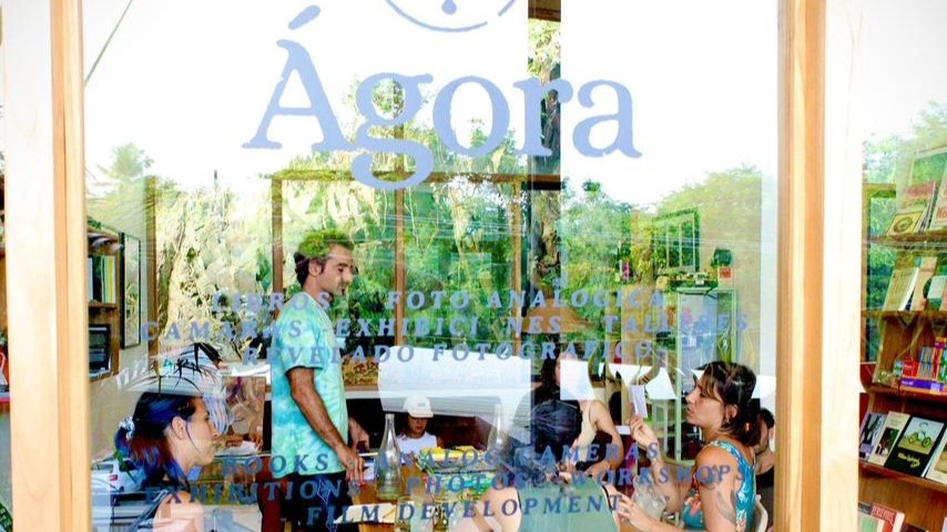 Agora Gallery entrance in Santa Teresa, Costa Rica, with visitors attending a creative workshop and community event.