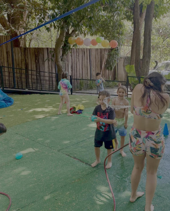 Children playing outside during Creativo art camp in Santa Teresa Costa Rica with playground activities, outdoor learning and creative exploration