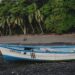 Traditional fishing boat resting at low tide in Malpaís Costa Rica during the early years before tourism transformed the coastline.