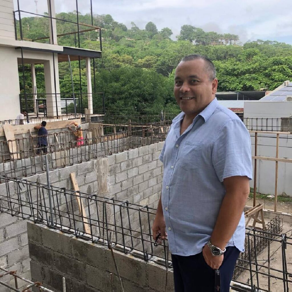 Alan standing in front of his office building during second-floor construction in Santa Teresa, Costa Rica.
