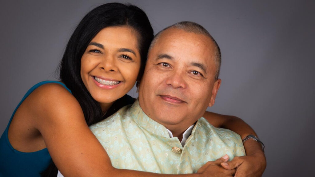 Alan and his wife Melissa embracing together in Malpaís, Costa Rica, sharing a warm and natural moment of love and connection.