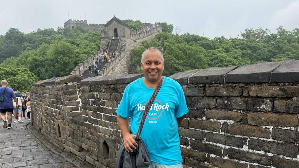 Alan standing on the Great Wall of China during his travels, marking another milestone in his lifelong goal of visiting all Seven Wonders of the World.