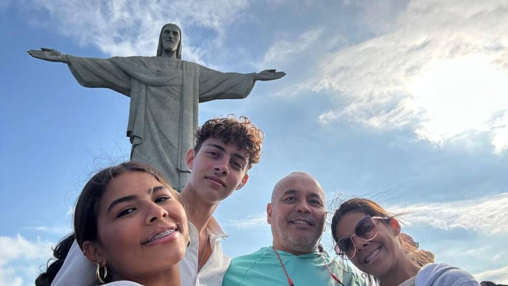Alan standing in front of the Christ the Redeemer statue in Rio de Janeiro, Brazil, during his international travels.