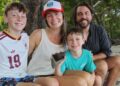 family from Atlanta relaxing on Santa Teresa Beach after their son discovered a fossilized Megalodon shark tooth during their Costa Rica vacation.