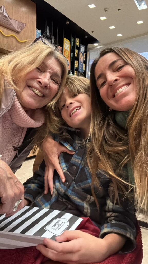 Etel with her daughter Andrea and grandson Zephyr, during a family visit in Argentina in 2026.